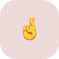 Yellow hand emoji with index and middle fingers crossed, centered on a light pink rounded square—perfect for wishing luck before calling coastal termite and pest control.